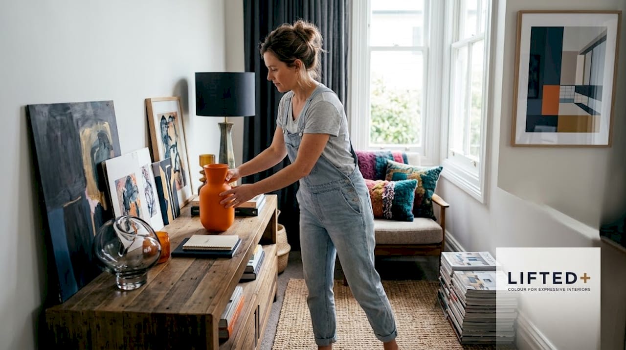 Woman styling joyful NZ home interior