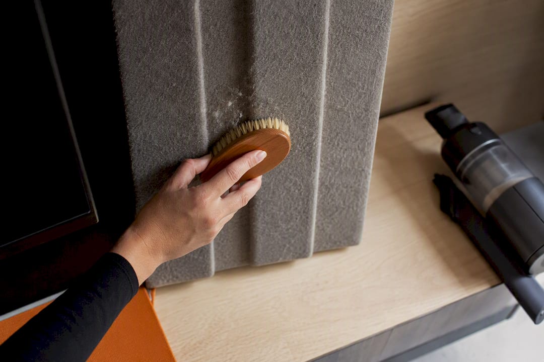5 No Drill Fixes Renters Can Do to Reduce Living Room Echo 2 Soft brush cleaning a textured PET felt surface