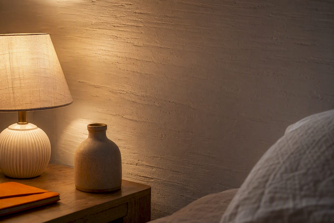 Low Contrast Small Bedroom Feature Walls With DwellForms™ for Renters 2 Bedside lamp revealing textured wall depth